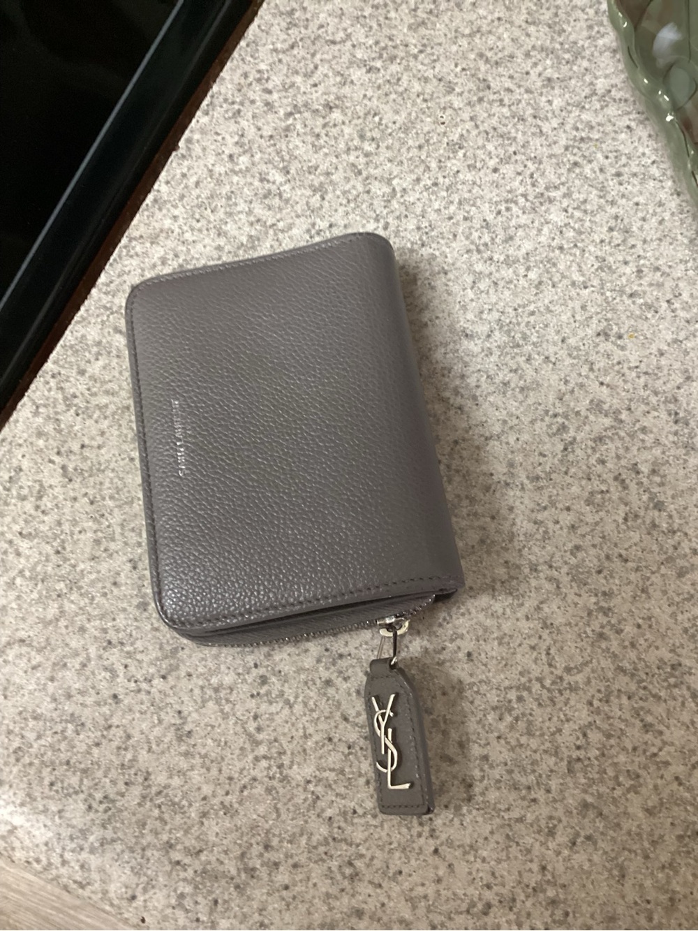YSL compact grey wallet.